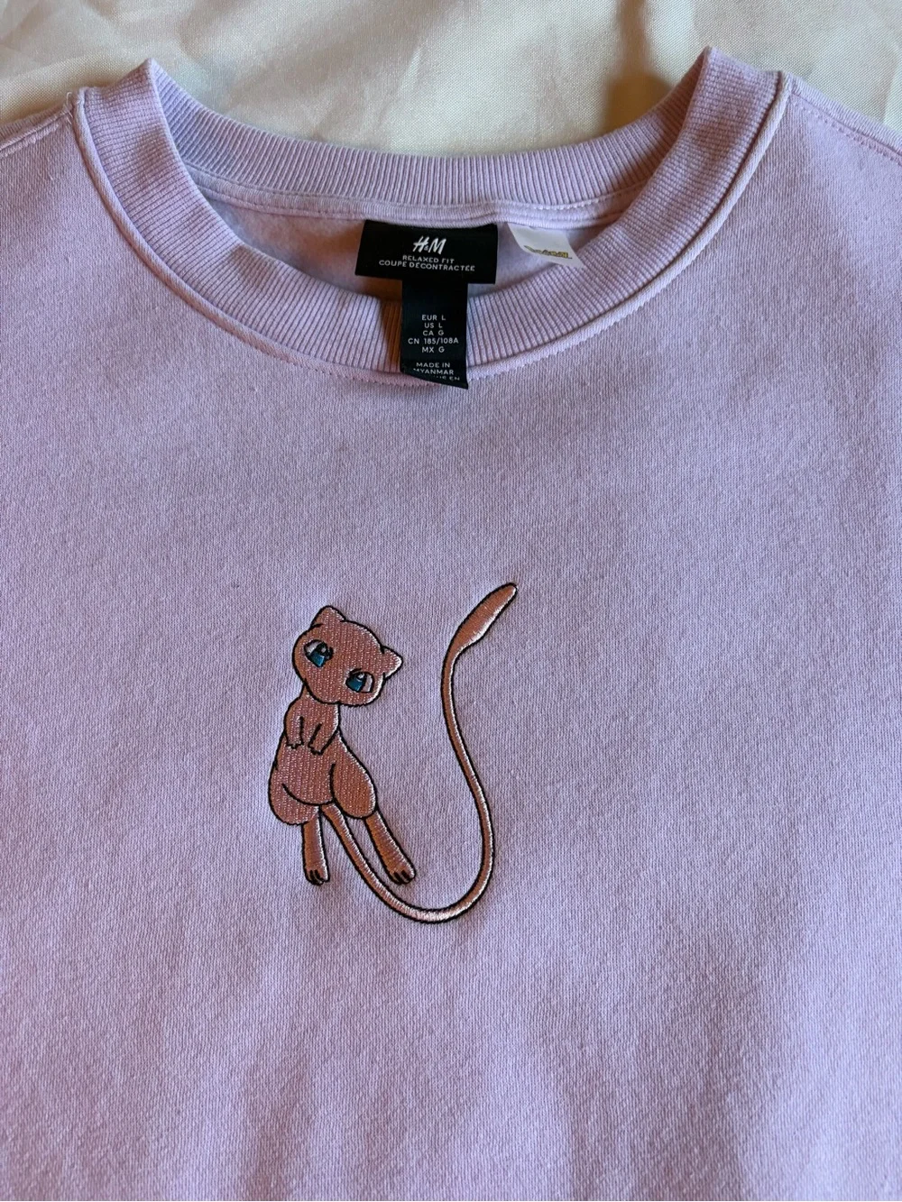 Pokémon Mew H&M Lavender Crewneck Sweater with Embroidered Cat Motif